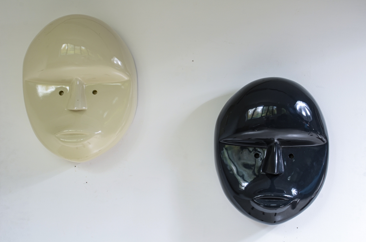 Pair of large lacquered fiberglass masks, Attributed to Joe Colombo; manufactured circa 1970.