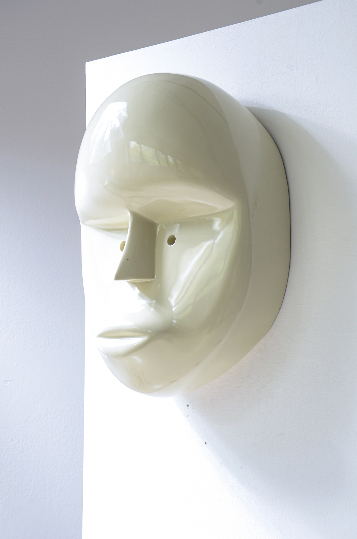 Pair of large lacquered fiberglass masks, Attributed to Joe Colombo; manufactured circa 1970.