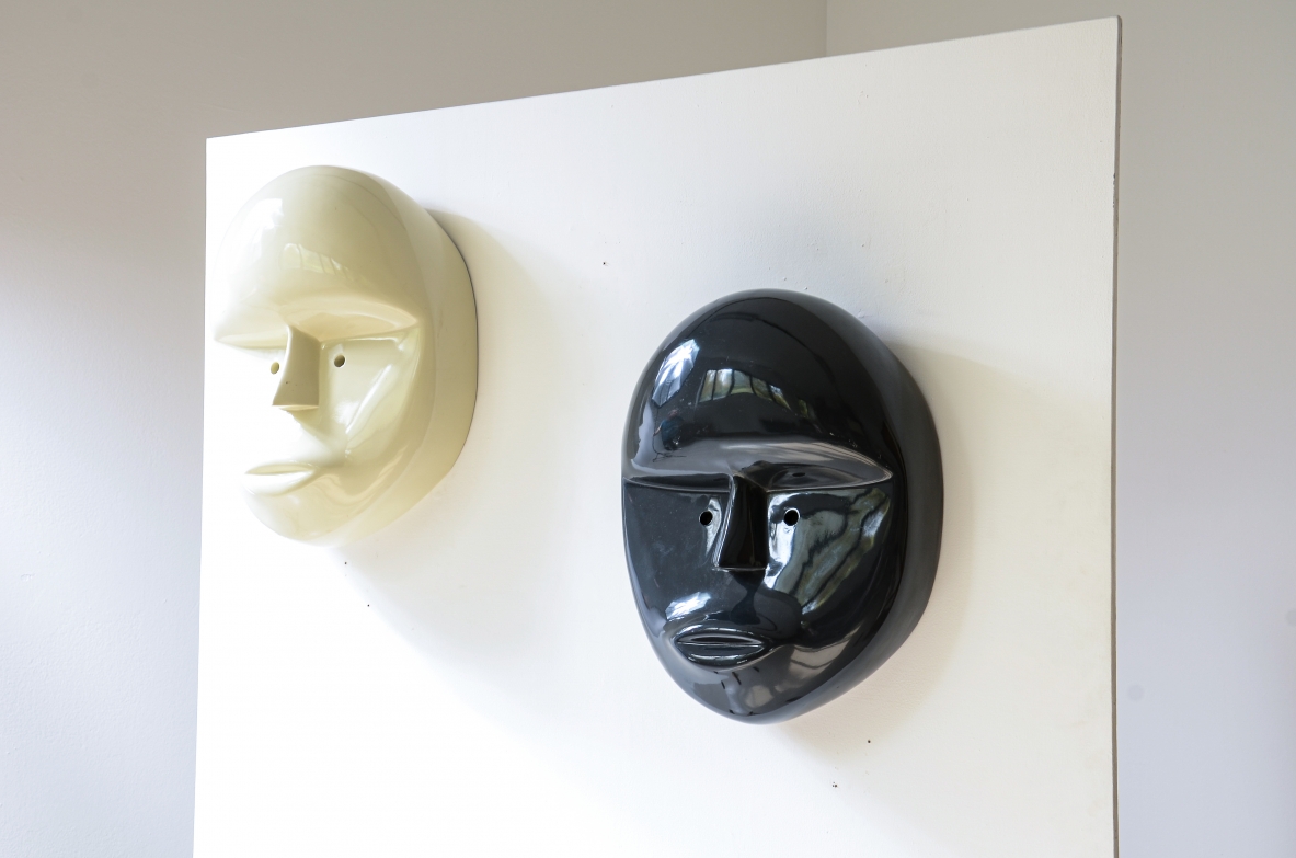 Pair of large lacquered fiberglass masks, Attributed to Joe Colombo; manufactured circa 1970.