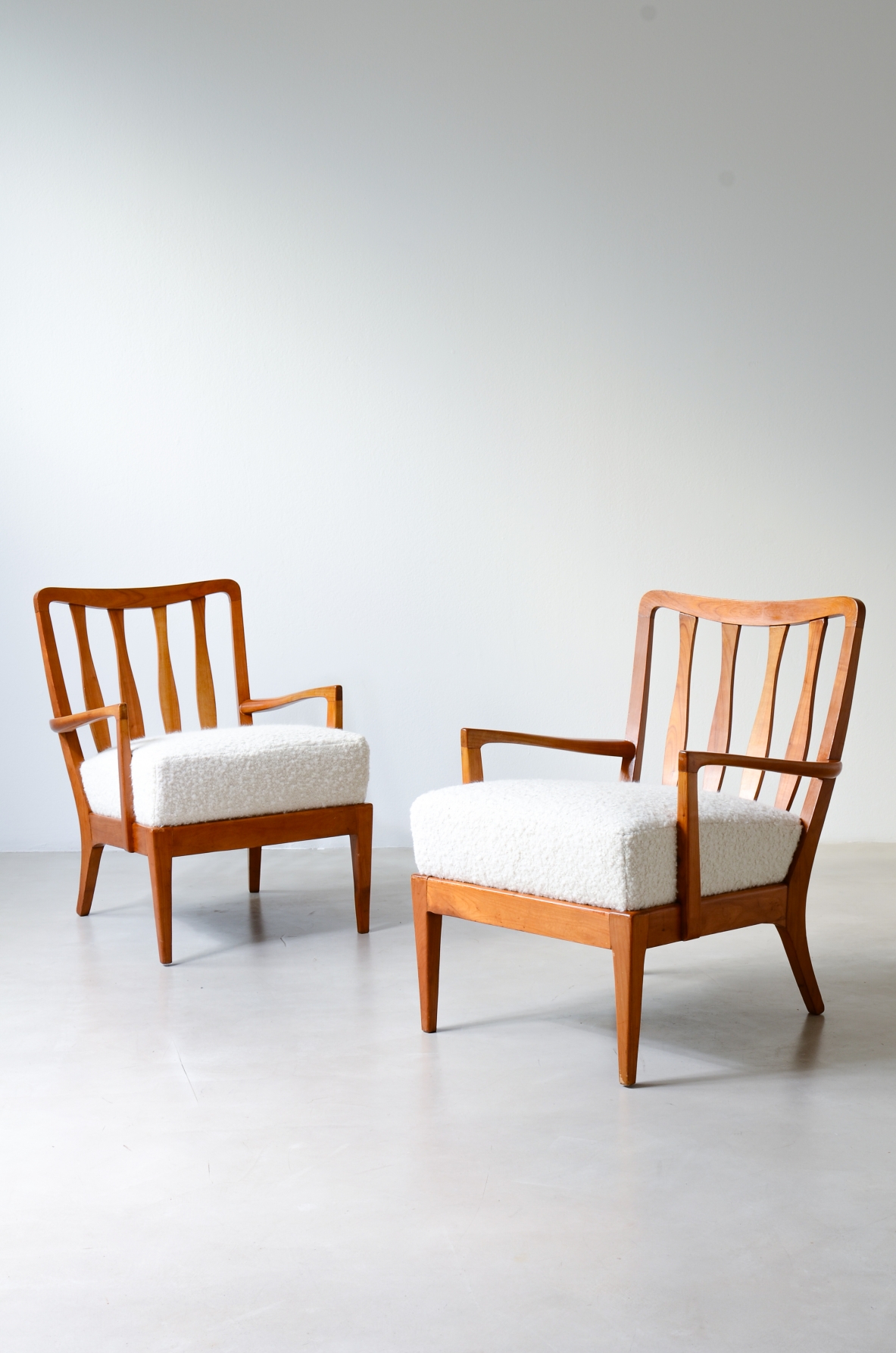 small armchairs in shaped cherry wood, Attributed to Paolo Buffa, circa 1940–50.