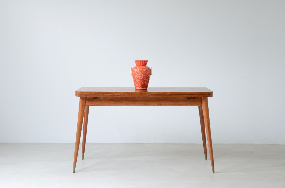 Console table in blond wood with turned legs and brass tips. around 1950.