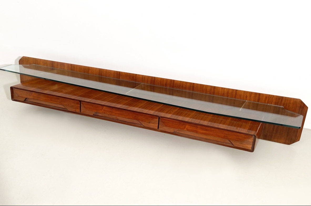 Italian 1960's hanging console table in rosewood with a nice shaped and thick crystal glass.
