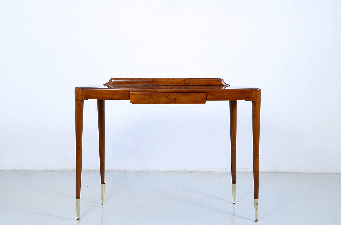 Elegant Italian 1950's console table with thin legs on long bronze tips.