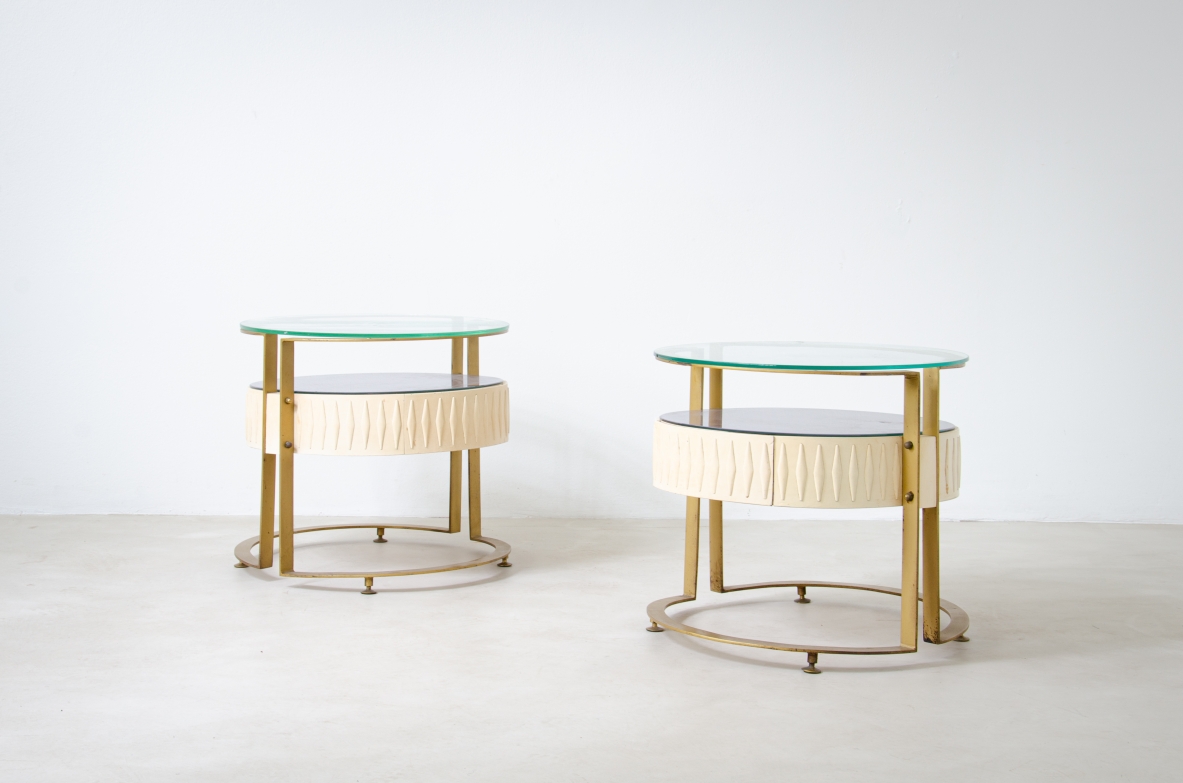 Pair of unique oval-shaped bedside tables with metal and lacquered wood structure, double top in glass. Italian manufacture, 1960's.