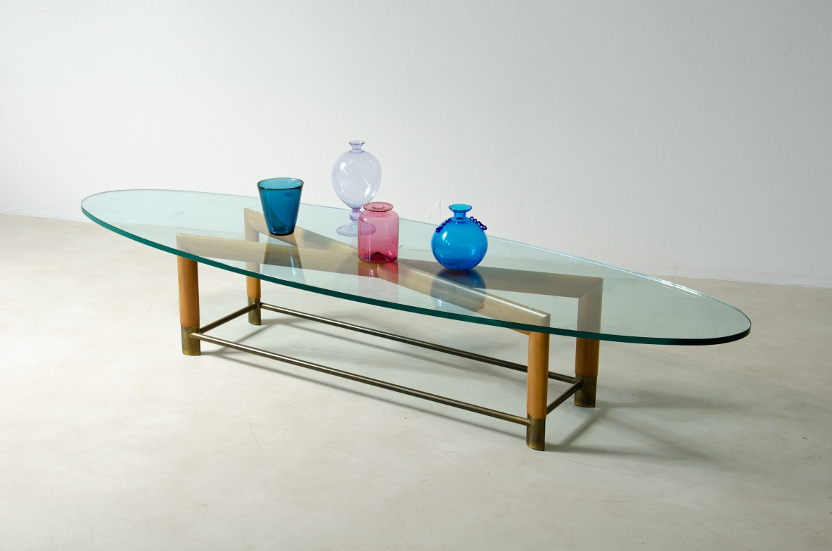 Low table with a "X" wooden structure, brass finishes and crystal glass top. 1950's Italian manufacture.
