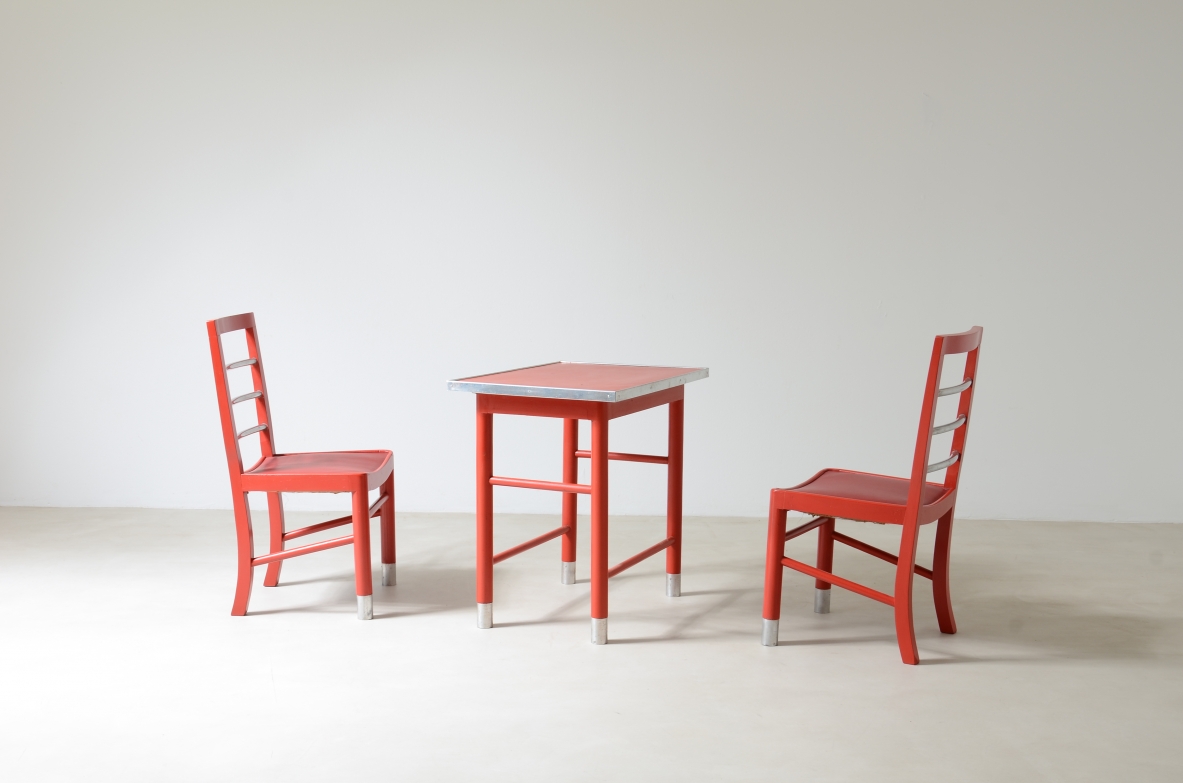 Marcello Piacentini (1881-1960)  Coffee table and two chairs in lacquered wood with satin metal details.  Excellent state of conservation.  Manufactured around 1930.