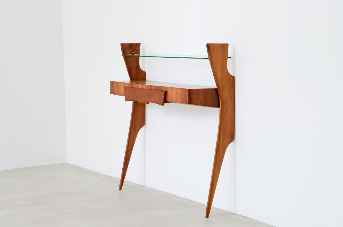 Console table in cherry wood with thin long  legs, one drawer and glass shelf.  1950's