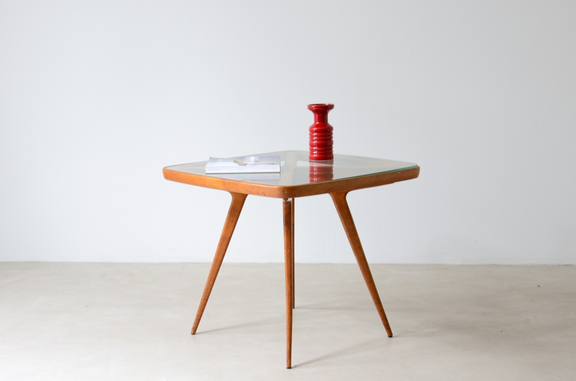 Table with visible cross on the top and legs and elegant thin legs.  Italian manufacture from the 1950s