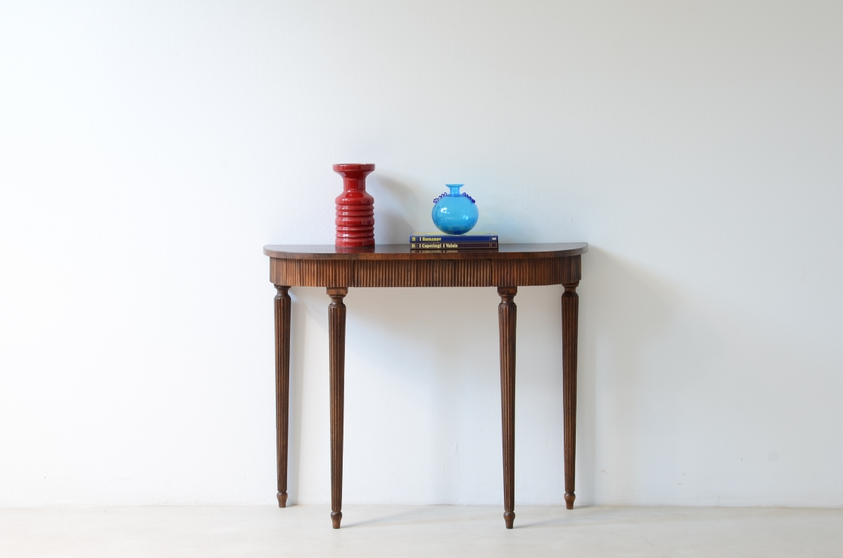 Small console in walnut with curved top and band in reeded wood.Italian manufacture 1940ca.