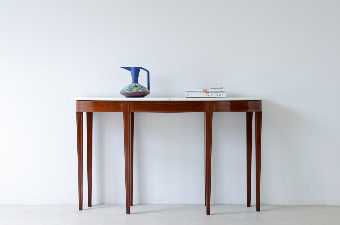 Elegant console with eight tapered legs and Carrara marble top.  Italian manufacture, ca.1950s.