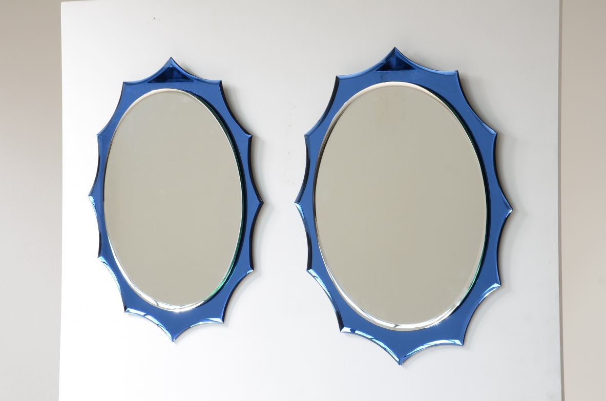 Giuseppe Raimondi  Coppia di eleganti specchiere a raggio di sole in cristallo molato e specchio.  Produzione Crystal Art 1960ca.