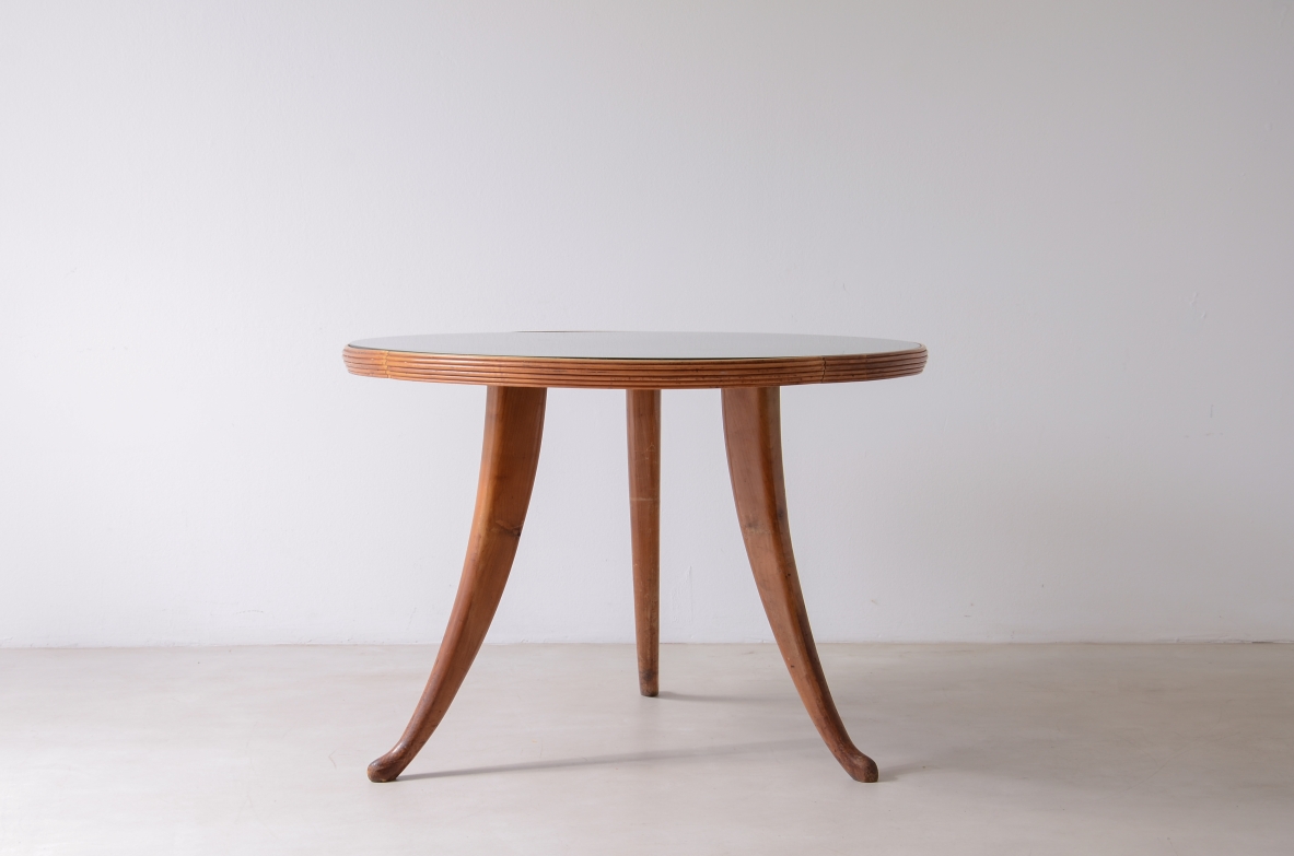 Elegant walnut table with sabre legs, striped band and cut glass top.  Italian manufacture from the 1940s.