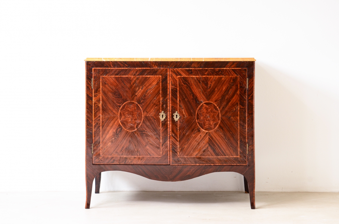 Splendid neoclassical two-door cabinet in veneered wood and inlaid with geometric motifs.Neapolitan cabinetmaking, ca. 1770.