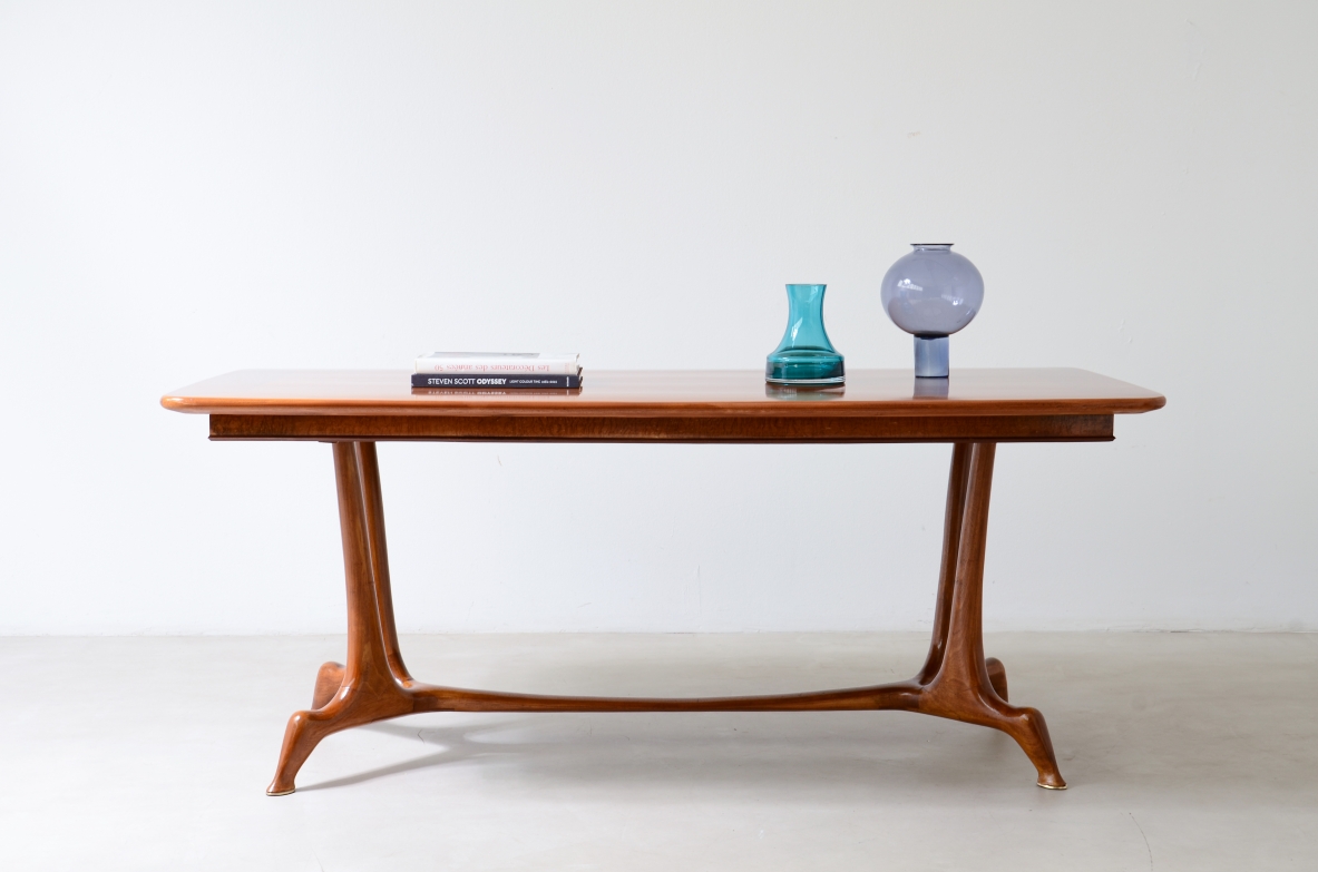 Unique cherry table with a sculptural base featuring taut lines, Made in Italy, circa 1950.